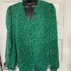 Long sleeve blouse with tie neck and ruffled sleeve cuffs. Size medium